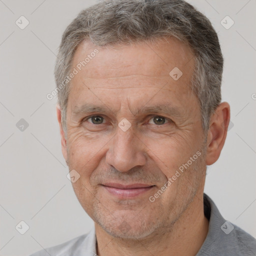 Joyful white middle-aged male with short  brown hair and brown eyes