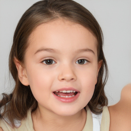 Joyful white child female with medium  brown hair and brown eyes