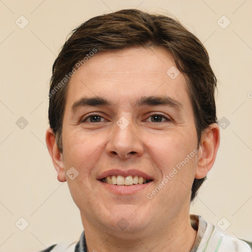 Joyful white adult male with short  brown hair and brown eyes