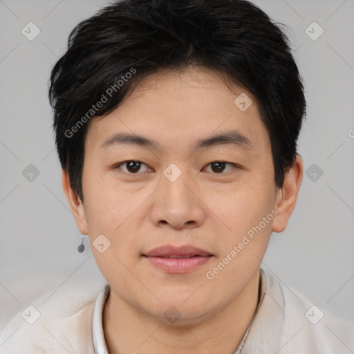 Joyful asian young-adult male with short  brown hair and brown eyes