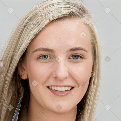 Joyful white young-adult female with long  brown hair and blue eyes