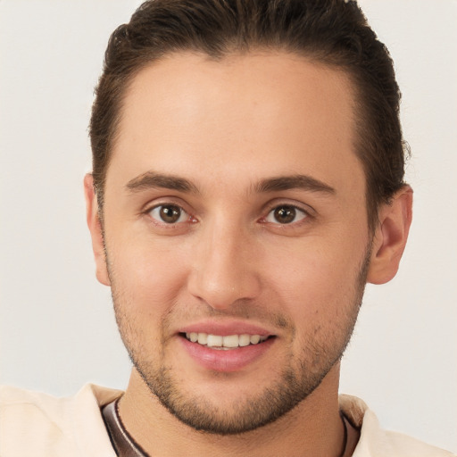 Joyful white young-adult male with short  brown hair and brown eyes