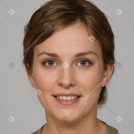 Joyful white young-adult female with medium  brown hair and grey eyes