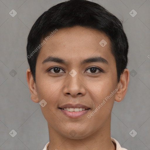 Joyful latino young-adult male with short  black hair and brown eyes