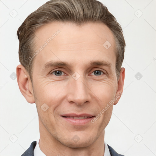 Joyful white adult male with short  brown hair and grey eyes