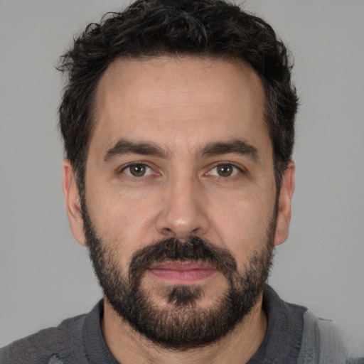 Neutral white adult male with short  black hair and brown eyes