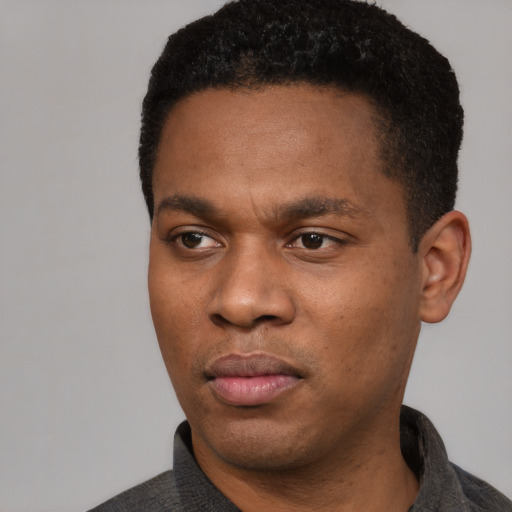 Neutral black young-adult male with short  black hair and brown eyes
