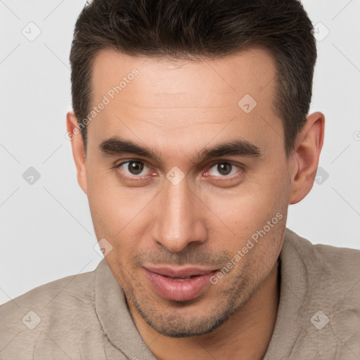 Joyful white young-adult male with short  brown hair and brown eyes