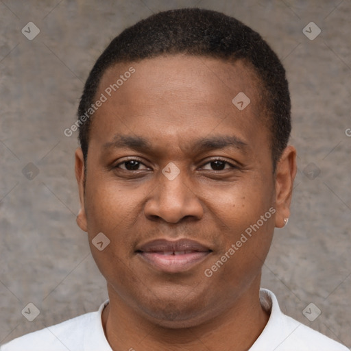 Joyful black young-adult male with short  brown hair and brown eyes