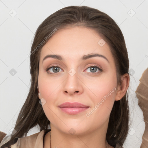 Joyful white young-adult female with long  brown hair and grey eyes