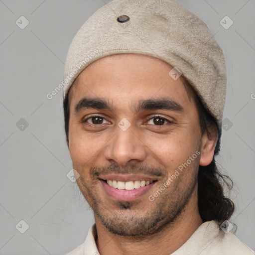 Joyful white young-adult male with short  black hair and brown eyes