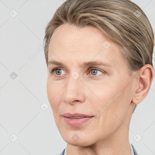 Joyful white adult female with short  brown hair and grey eyes