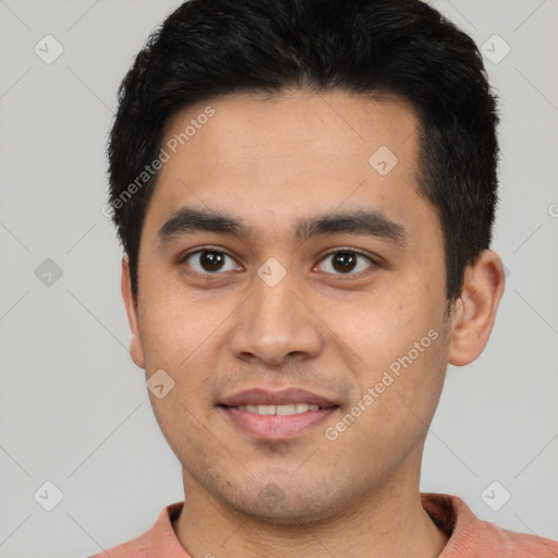 Joyful latino young-adult male with short  black hair and brown eyes