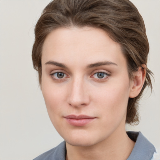 Neutral white young-adult female with medium  brown hair and grey eyes