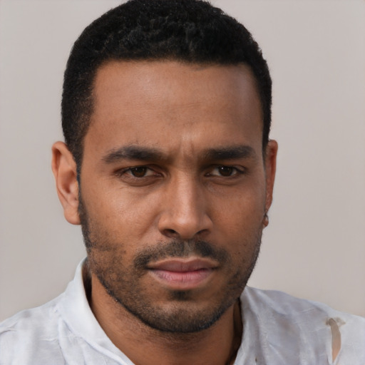 Neutral black young-adult male with short  black hair and brown eyes