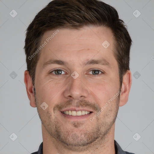 Joyful white adult male with short  brown hair and grey eyes