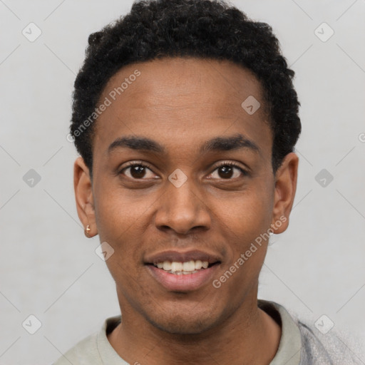 Joyful black young-adult male with short  black hair and brown eyes