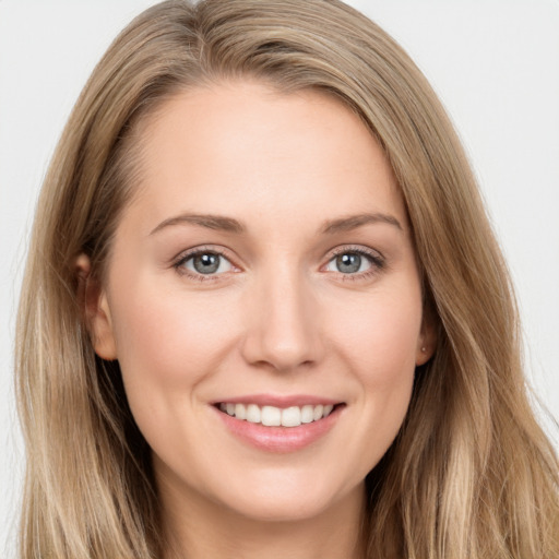 Joyful white young-adult female with long  brown hair and grey eyes