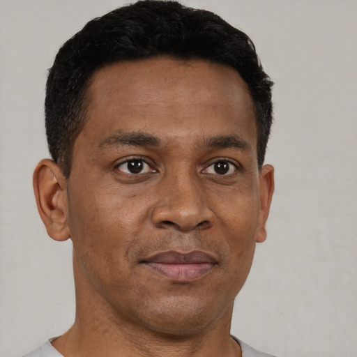 Neutral black adult male with short  brown hair and brown eyes