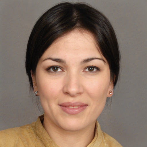 Joyful white young-adult female with medium  brown hair and brown eyes
