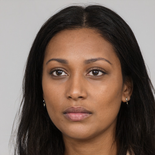 Neutral black young-adult female with long  black hair and brown eyes
