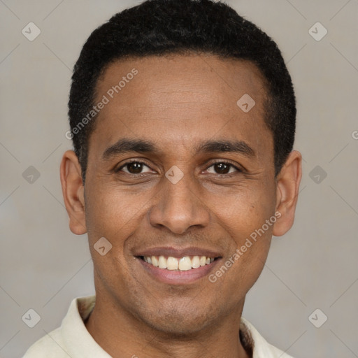 Joyful latino young-adult male with short  brown hair and brown eyes