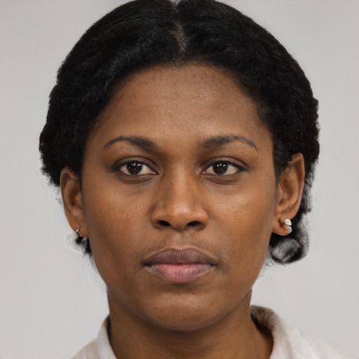 Neutral black young-adult female with short  black hair and brown eyes