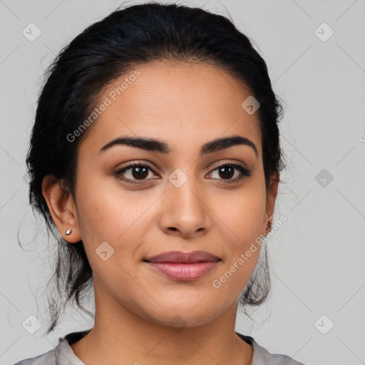 Joyful latino young-adult female with medium  black hair and brown eyes