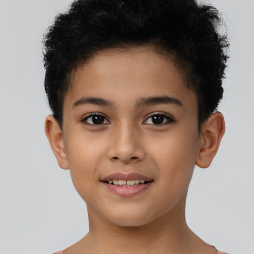 Joyful latino child male with short  brown hair and brown eyes