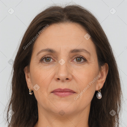 Joyful white adult female with long  brown hair and brown eyes