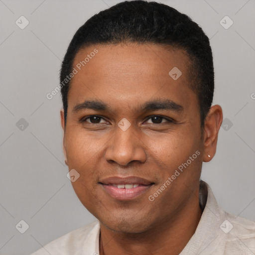 Joyful black young-adult male with short  black hair and brown eyes