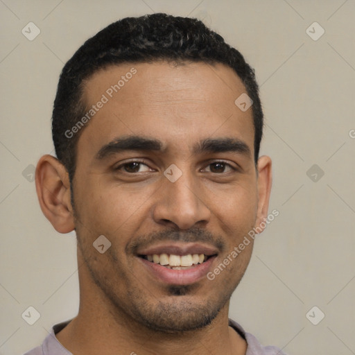 Joyful latino young-adult male with short  brown hair and brown eyes