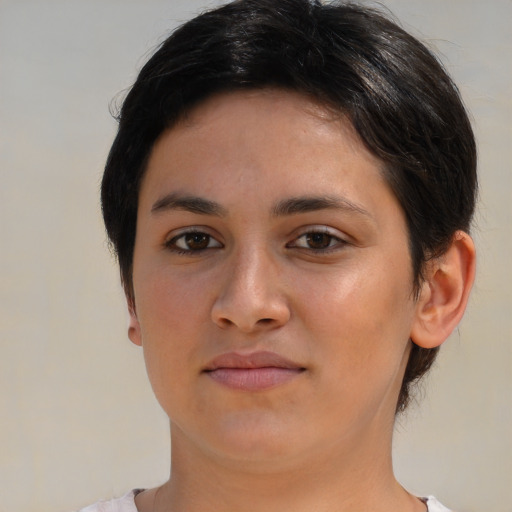 Joyful latino young-adult female with short  brown hair and brown eyes