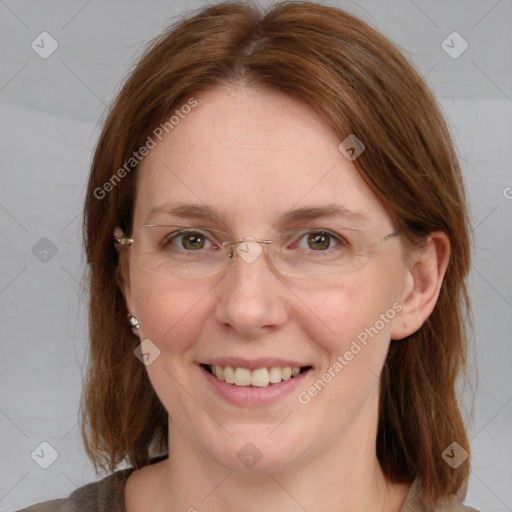 Joyful white adult female with medium  brown hair and blue eyes