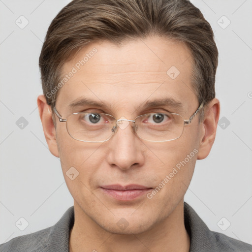 Joyful white adult male with short  brown hair and grey eyes