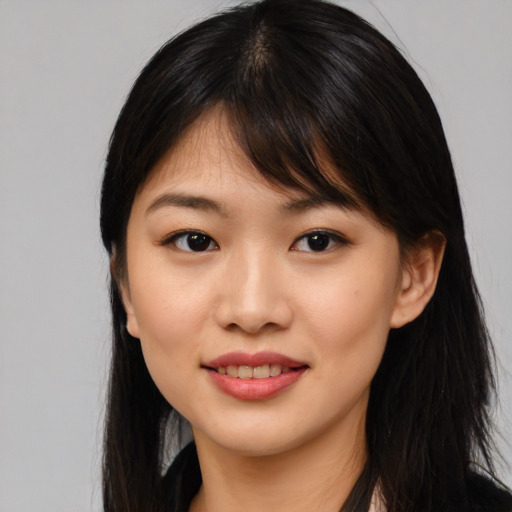 Joyful asian young-adult female with long  black hair and brown eyes