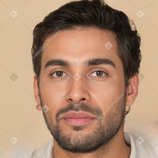 Joyful white young-adult male with short  brown hair and brown eyes