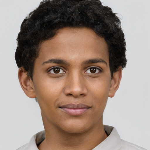 Joyful black young-adult male with short  brown hair and brown eyes