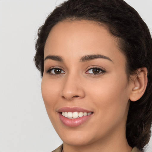 Joyful white young-adult female with medium  brown hair and brown eyes