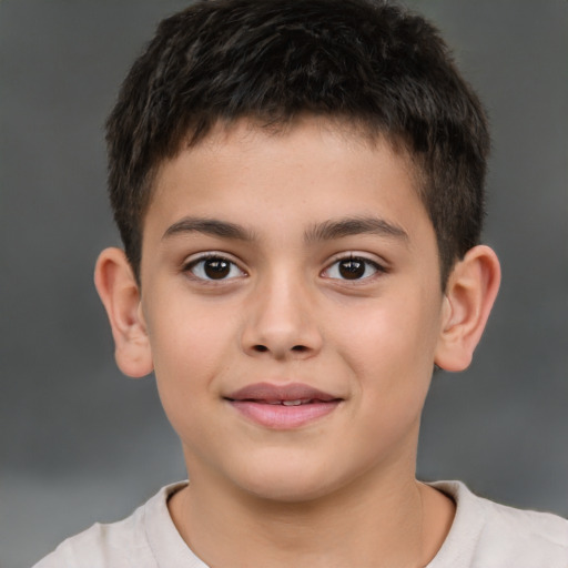 Joyful white child male with short  brown hair and brown eyes