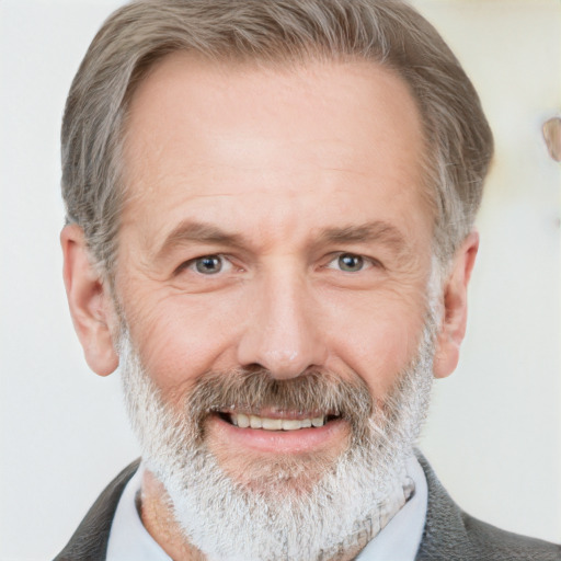 Joyful white middle-aged male with short  gray hair and grey eyes