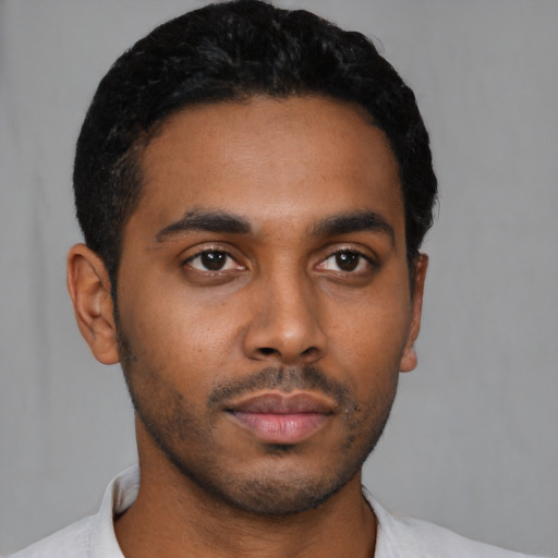 Neutral latino young-adult male with short  black hair and brown eyes
