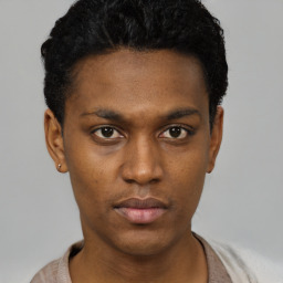 Neutral black young-adult male with short  black hair and brown eyes