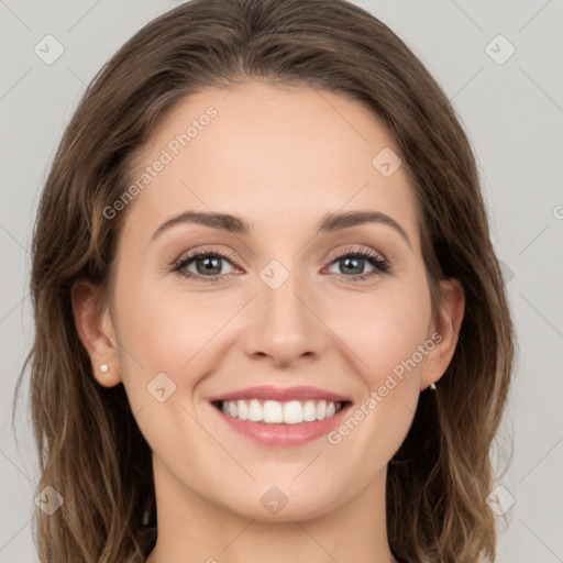 Joyful white young-adult female with long  brown hair and green eyes