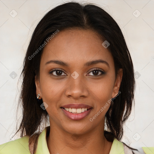 Joyful black young-adult female with long  brown hair and brown eyes