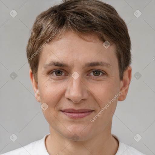 Joyful white adult male with short  brown hair and brown eyes