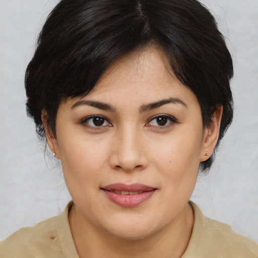 Joyful asian young-adult female with medium  brown hair and brown eyes
