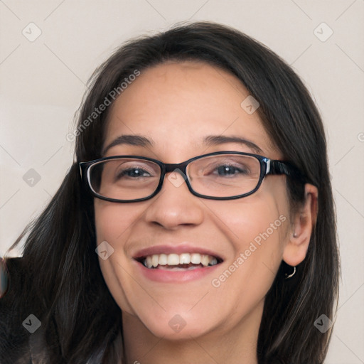 Joyful white young-adult female with long  brown hair and blue eyes