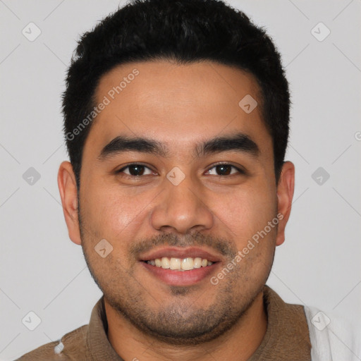 Joyful latino young-adult male with short  black hair and brown eyes