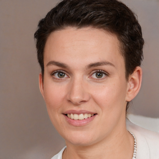 Joyful white young-adult female with short  brown hair and brown eyes